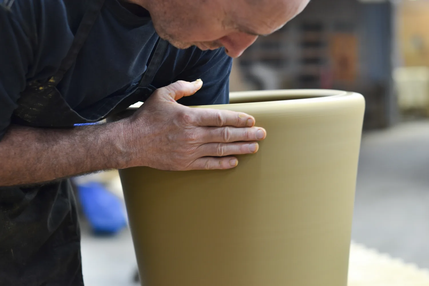 Ian Foote, Head Potter, shaping a large pot