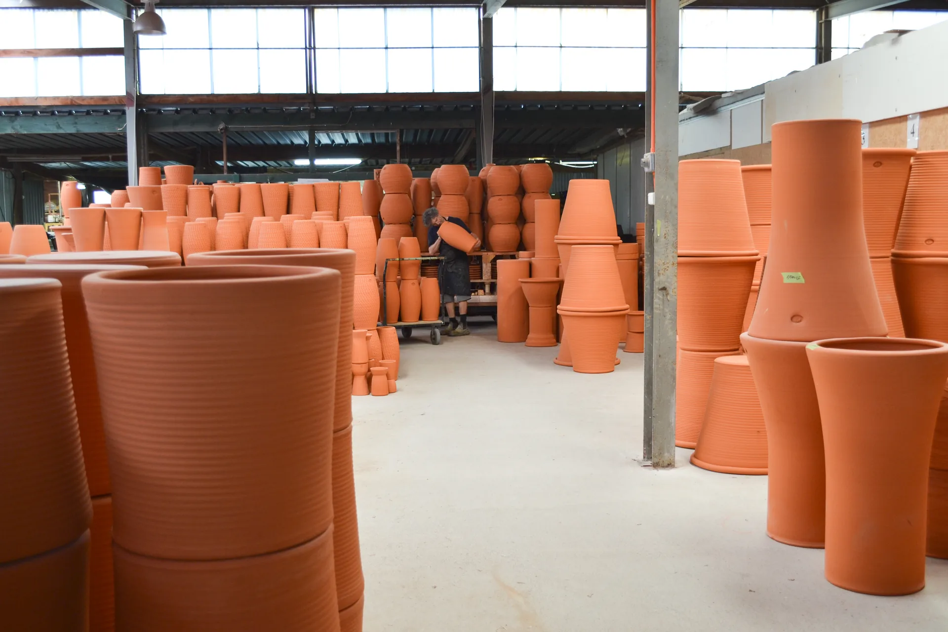 Rows of freshly thrown Morris & James umbrella pots in the Matakana factory