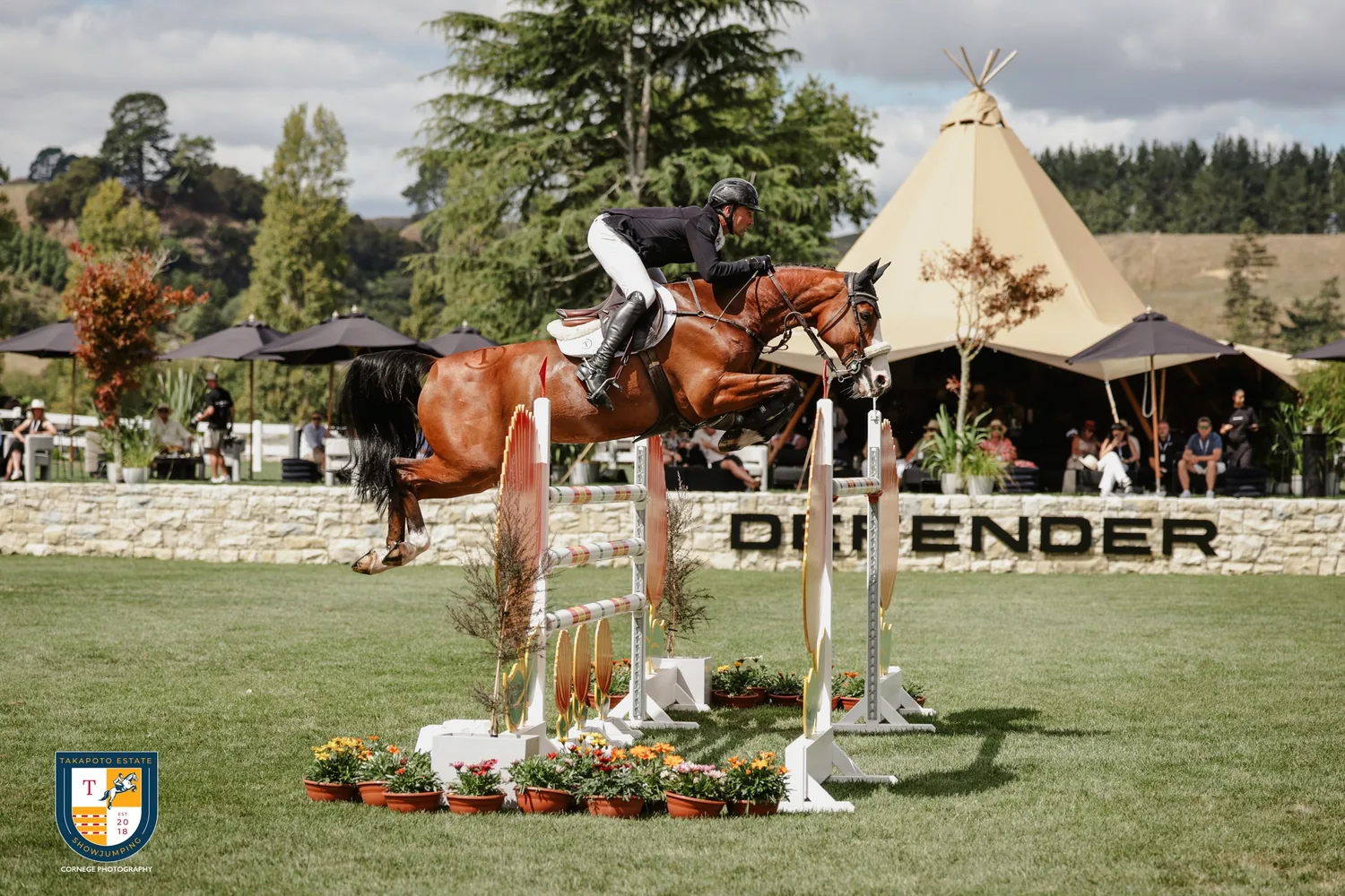 Riders on the grounds with event sponsor vehicle