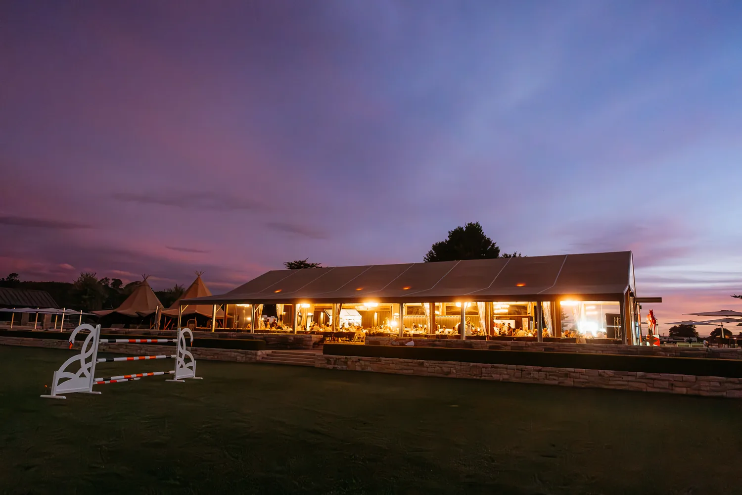The pavilion lit up at dusk