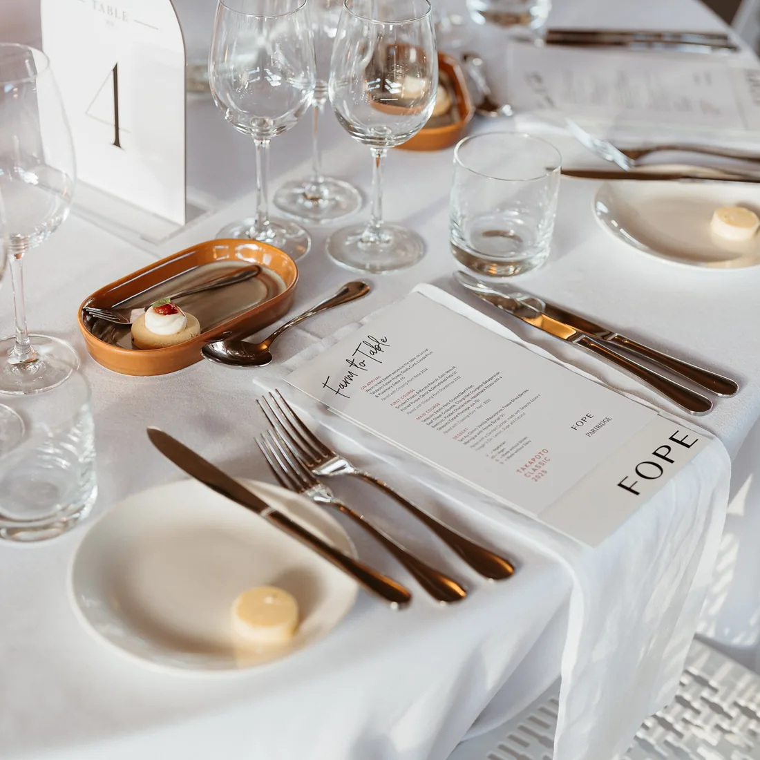 Takapoto Classic 2025 — place setting with menu