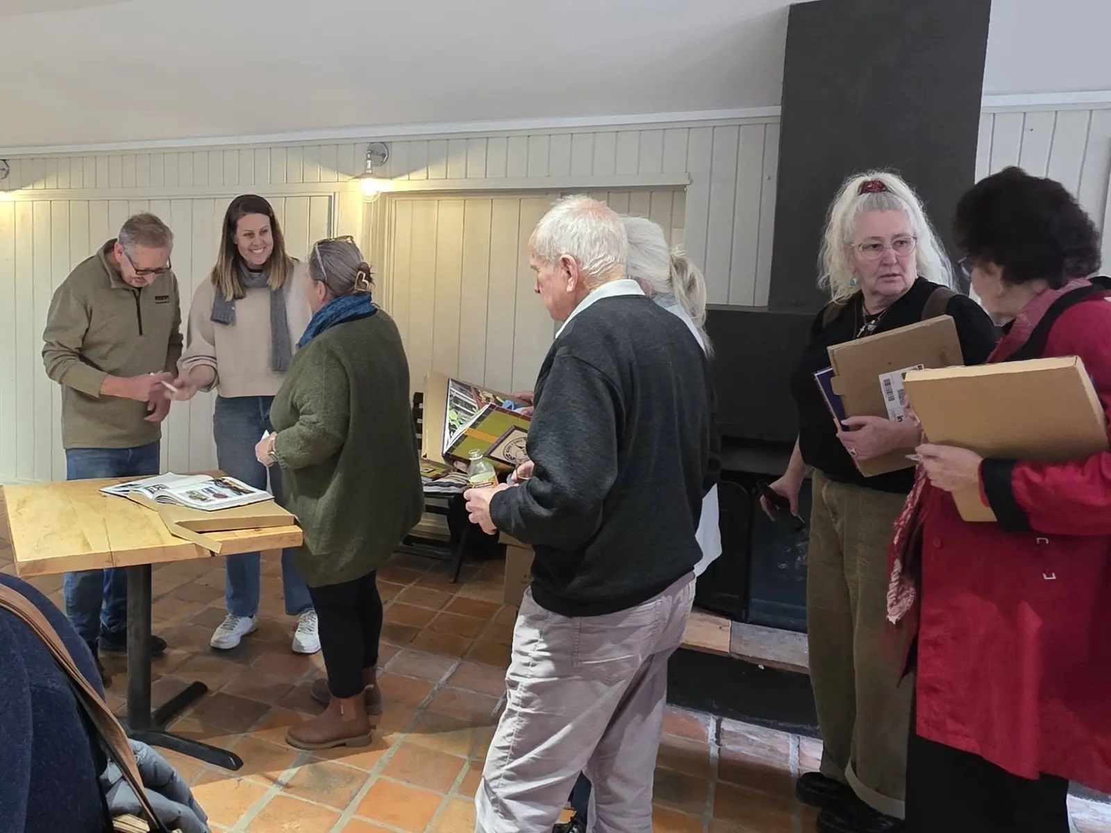 Guests gathering with their books at the signing