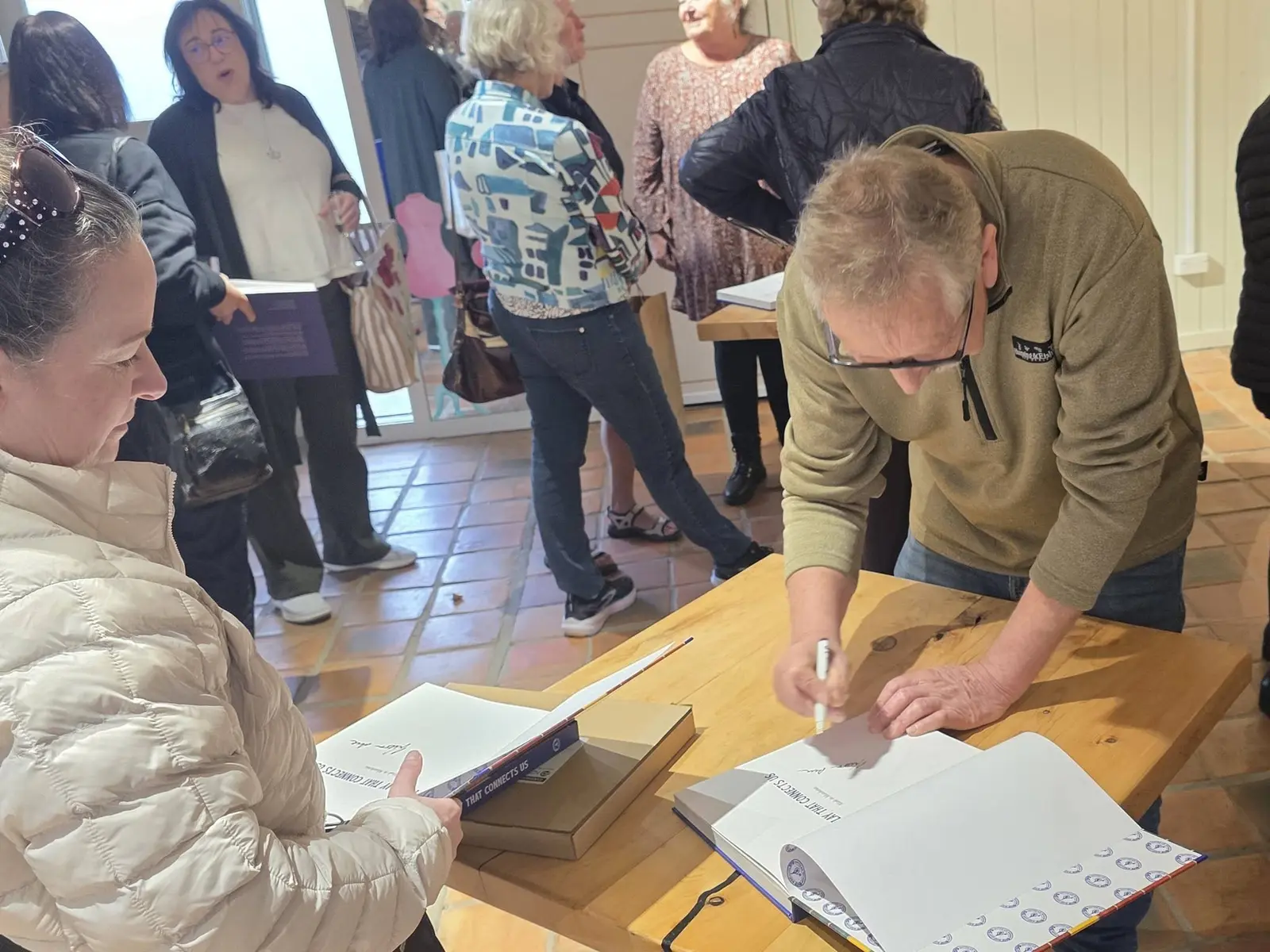 A copy being signed at the table