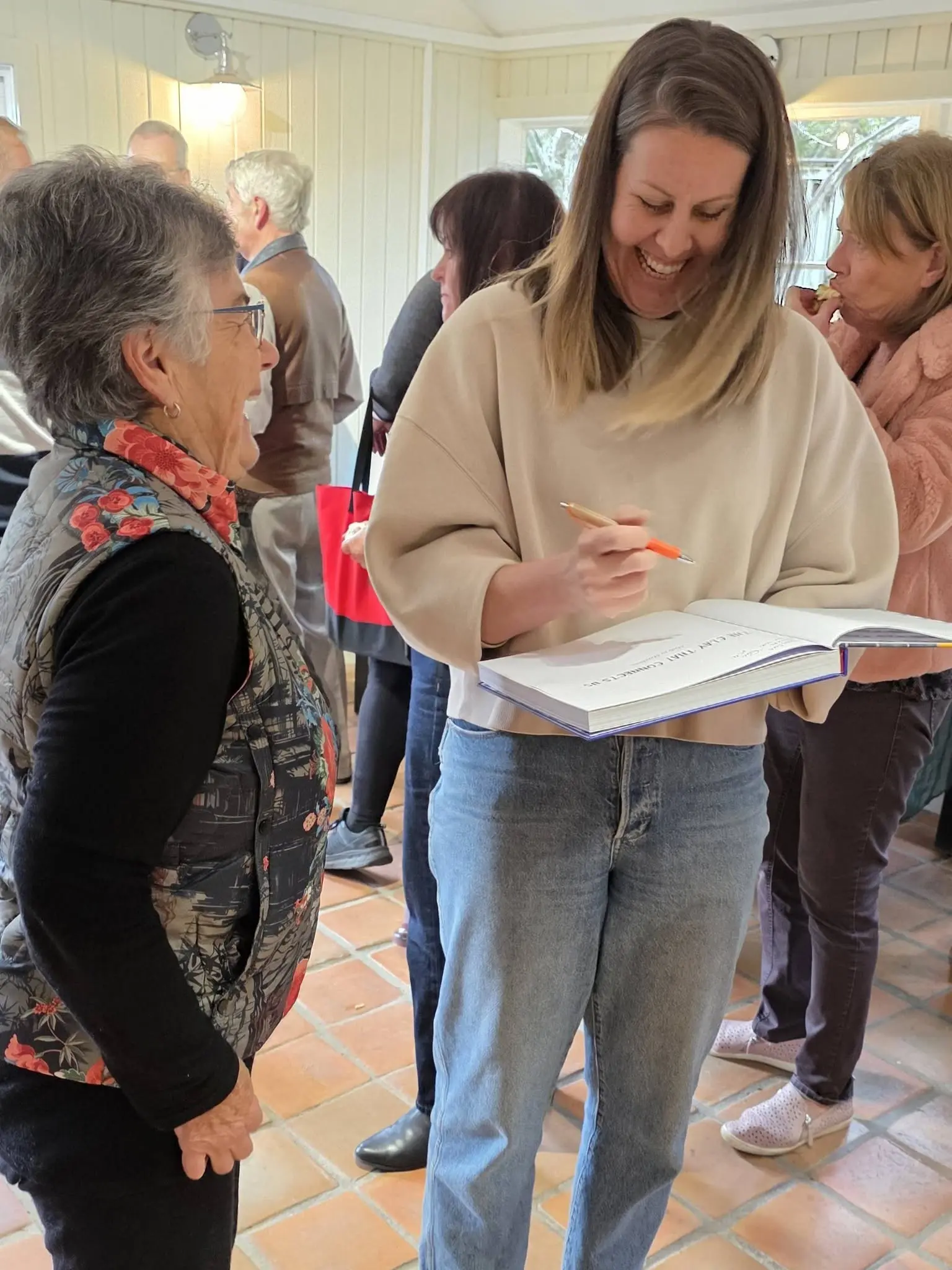 A book signed mid-conversation at the event